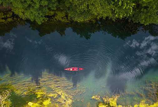 canoeing-on-the-river-picture-id1162405475.jpg